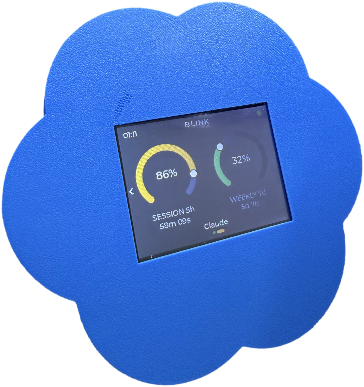 The Codex logo case: a blue case in the shape of the Codex mark, its screen reading BLINK with a session dial at 86 per cent and a weekly dial at 32 per cent.